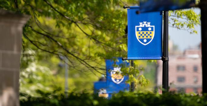 Pitt banners hang throughout the Pittsburgh campus.